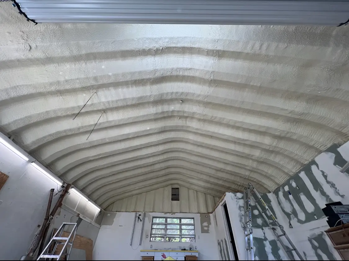 Spray polyurethane foam applied to the underside of a metal roof deck in Fairhaven